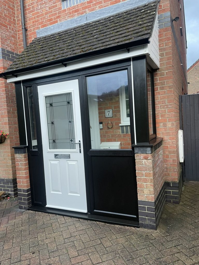 Front door with porch and window